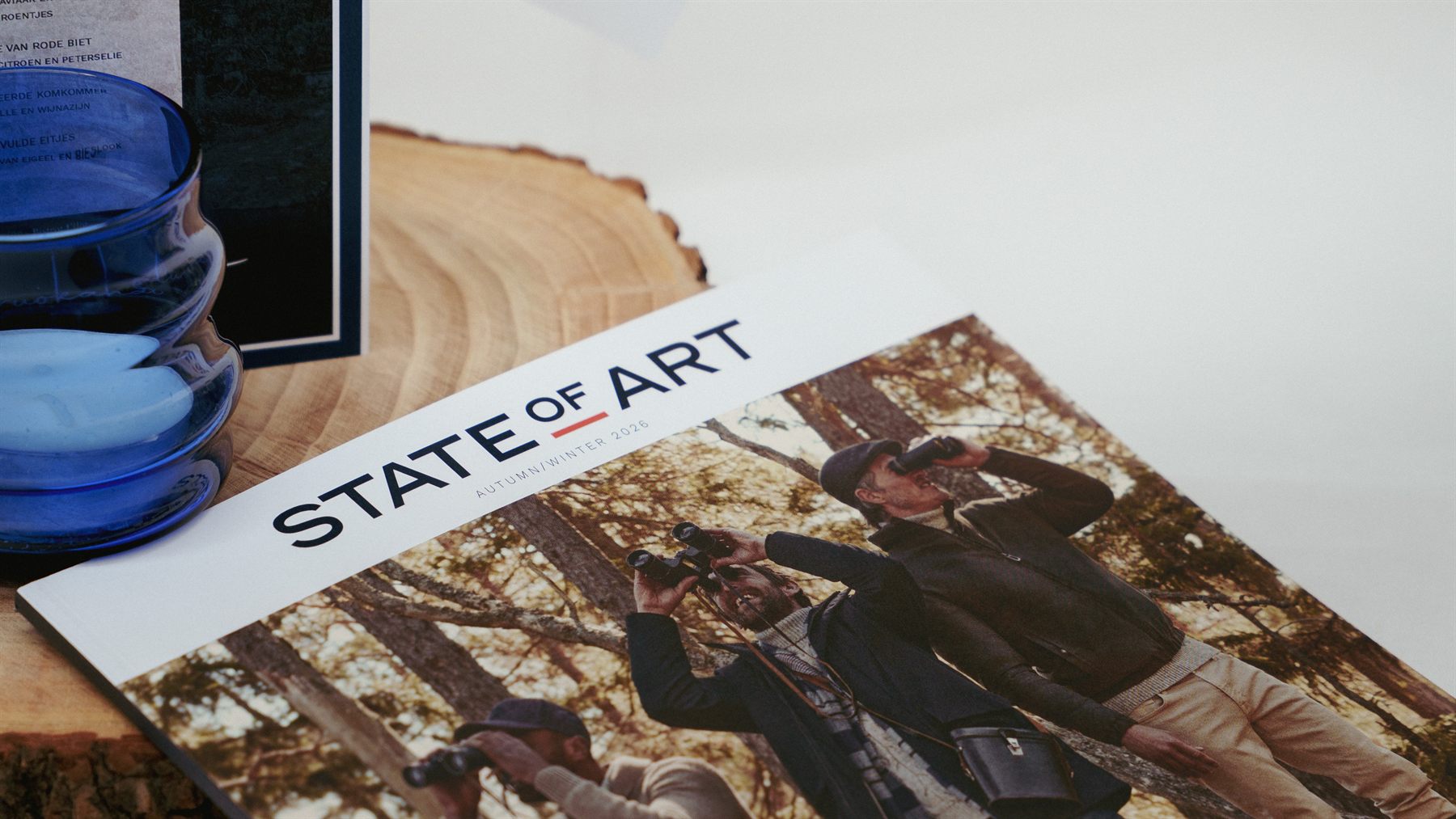 Magazine van State Of Art op een houten schijf